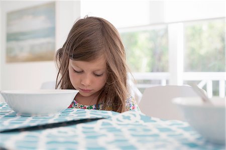 simsearch:614-06043612,k - Girl at dining table looking down Stock Photo - Premium Royalty-Free, Code: 614-08535732