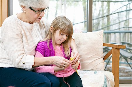 simsearch:649-03858052,k - Senior woman and granddaughter knitting on living room sofa Stock Photo - Premium Royalty-Free, Code: 614-08535833