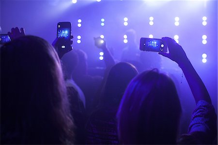 group of people at concert, taking photographs of stage, using smartphones, rear view Stock Photo - Premium Royalty-Free, Code: 614-08578343