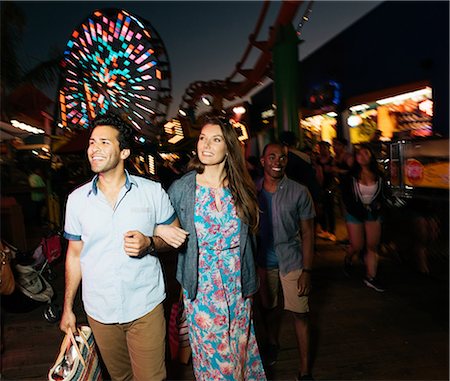 santa monica - Young couple strolling in amusement park at night, Santa Monica, California, USA Stock Photo - Premium Royalty-Free, Code: 614-08641666