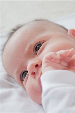 simsearch:614-07031850,k - Head shot of baby boy lying down Stock Photo - Premium Royalty-Free, Code: 614-08684704