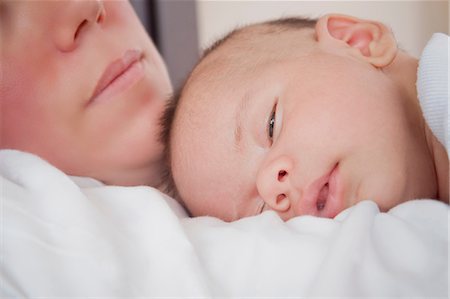 simsearch:614-07031850,k - Baby boy sleeping on mothers chest Stock Photo - Premium Royalty-Free, Code: 614-08684702