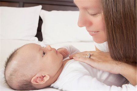 simsearch:614-07031844,k - Mother admiring baby boy lying on bed Stock Photo - Premium Royalty-Free, Code: 614-08684714
