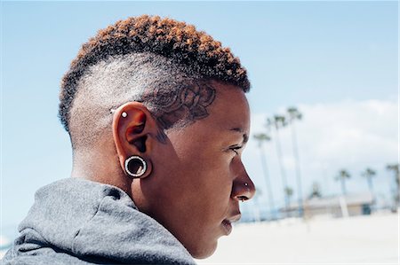 Portrait of woman with mohawk looking away Stock Photo - Premium Royalty-Free, Code: 614-08685124
