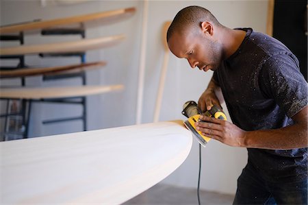 simsearch:6115-07109879,k - Craftsman making paddleboard in workshop Stock Photo - Premium Royalty-Free, Code: 614-08726622