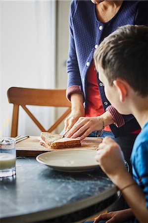 Mother making son sandwich Stock Photo - Premium Royalty-Free, Code: 614-08721030