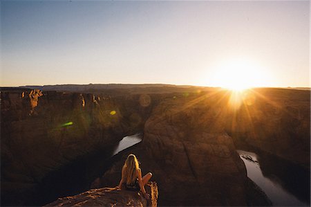 Woman relaxing and enjoying view, Horseshoe Bend, Page, Arizona, USA Stock Photo - Premium Royalty-Free, Code: 614-08826737