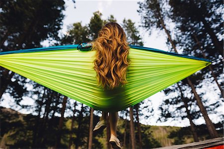 simsearch:614-05557077,k - Rear view of woman sitting in hammock, Rocky Mountain National Park, Colorado, USA Stock Photo - Premium Royalty-Free, Code: 614-08826817