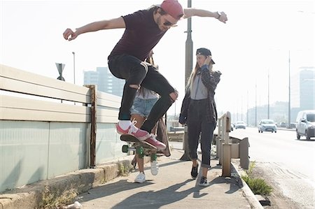 skating in the street - Skateboarders walking and skateboarding together on street, Budapest, Hungary Stock Photo - Premium Royalty-Free, Code: 614-08826940