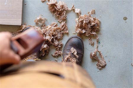 simsearch:6115-07109879,k - Carpenter at his workshop, standing on wood shavings Stock Photo - Premium Royalty-Free, Code: 614-08827009