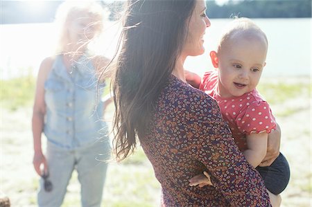 Senior woman with daughter and granddaughter at riverside Stock Photo - Premium Royalty-Free, Code: 614-08827029