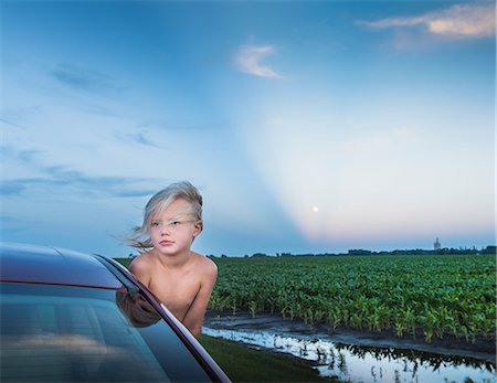 simsearch:649-09078617,k - Boy leaning out of car window looking away Stock Photo - Premium Royalty-Free, Code: 614-08827138