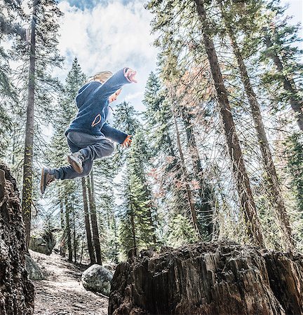 simsearch:614-08030822,k - Young boy jumping in forest, mid air, Sequoia National Park, California, USA Stock Photo - Premium Royalty-Free, Code: 614-08827165