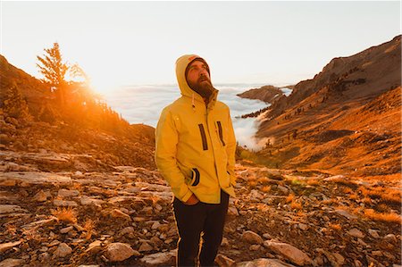 Male hiker looking up from rocky landscape, Mineral King, Sequoia National Park, California, USA Stock Photo - Premium Royalty-Free, Code: 614-08821415