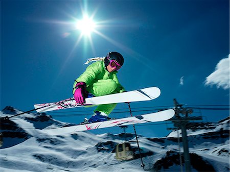 simsearch:6113-07542775,k - Female skier jumping Stock Photo - Premium Royalty-Free, Code: 614-08865434
