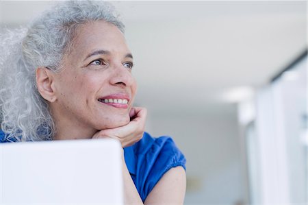 simsearch:6113-07565805,k - Businesswoman sitting at desk Stock Photo - Premium Royalty-Free, Code: 614-08865435