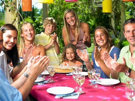 People celebrating a girl's birthday Stock Photo - Premium Royalty-Free, Code: 614-08865754