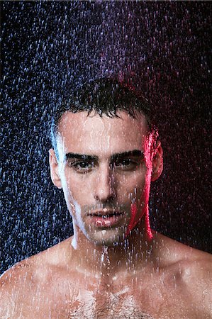 simsearch:614-03982063,k - Young man in the rain topless Photographie de stock - Premium Libres de Droits, Code: 614-08865800