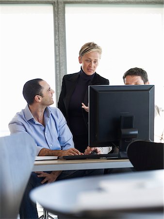 simsearch:614-06043814,k - Group of business people at office desk Stock Photo - Premium Royalty-Free, Code: 614-08866024