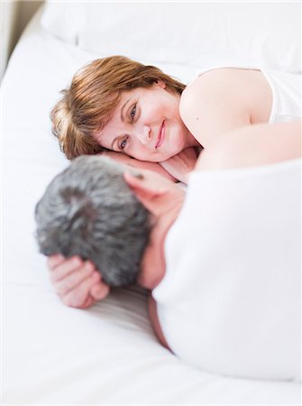 simsearch:649-05556305,k - Eldery couple lying in bed smiling Stock Photo - Premium Royalty-Free, Code: 614-08866092