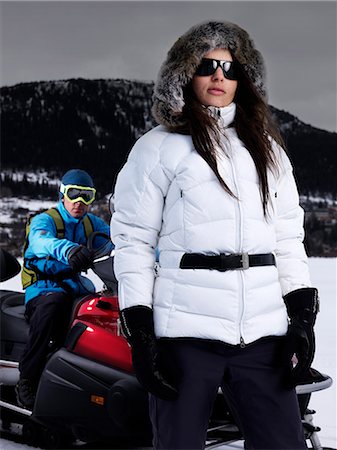 simsearch:614-06896253,k - Lady posing in front of man on skidoo. Stock Photo - Premium Royalty-Free, Code: 614-08866500