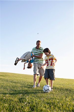 simsearch:614-07239995,k - Father And Boys Playing Soccer Stock Photo - Premium Royalty-Free, Code: 614-08866752