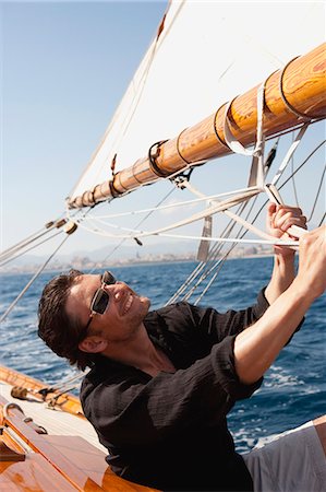 simsearch:614-00602699,k - man holding on to ropes on deck Stock Photo - Premium Royalty-Free, Code: 614-08866816