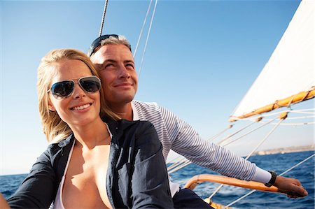 simsearch:649-05520995,k - couple steering a sailing boat Stock Photo - Premium Royalty-Free, Code: 614-08866827