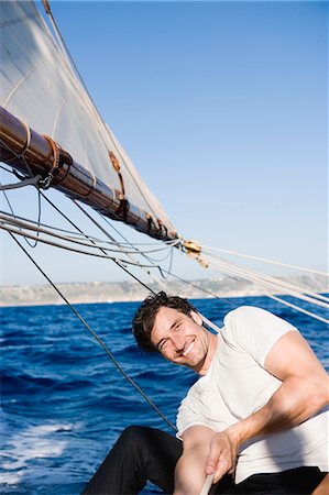 simsearch:614-00602699,k - man smiling steering a sailing boat Stock Photo - Premium Royalty-Free, Code: 614-08866829