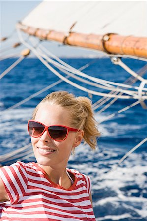 simsearch:614-00602699,k - woman sitting on a sailing boat Stock Photo - Premium Royalty-Free, Code: 614-08866820