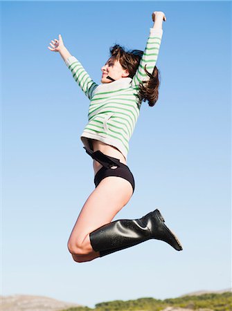 simsearch:400-07181052,k - woman jumping into the air Stock Photo - Premium Royalty-Free, Code: 614-08866890