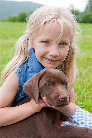 simsearch:649-06401393,k - Young girl hugging her puppy Stock Photo - Premium Royalty-Free, Code: 614-08867048