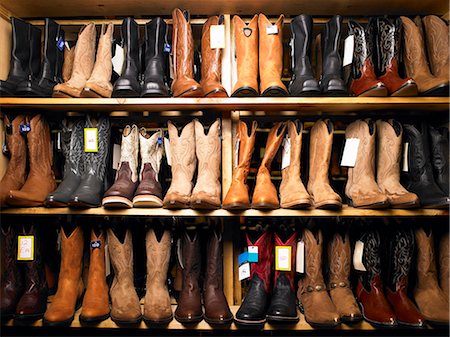 Cowboy boots on shelves Stock Photo - Premium Royalty-Free, Code: 614-08867337