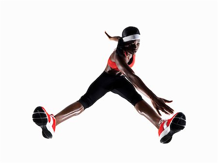 simsearch:695-05768377,k - Female Athlete Stretching Stock Photo - Premium Royalty-Free, Code: 614-08867392