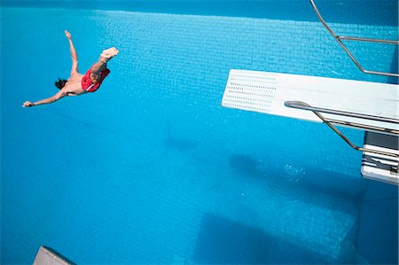 Man diving into a pool Stock Photo - Premium Royalty-Free, Code: 614-08867554