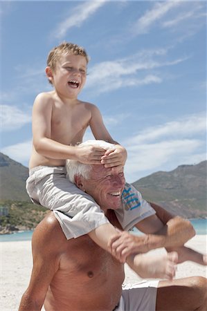 simsearch:649-03858052,k - Older man with grandson on beach Stock Photo - Premium Royalty-Free, Code: 614-08867745