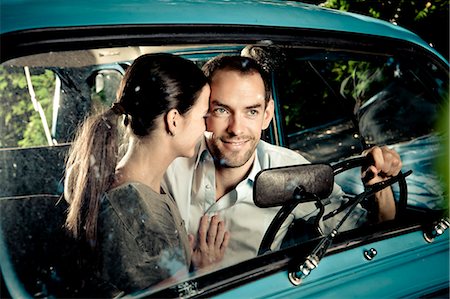 simsearch:649-05556305,k - Kissing couple driving car at night Stock Photo - Premium Royalty-Free, Code: 614-08868038