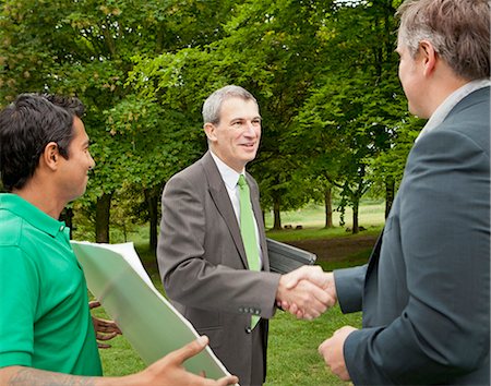 simsearch:6113-07242223,k - Businessmen shaking hands in park Stock Photo - Premium Royalty-Free, Code: 614-08868916