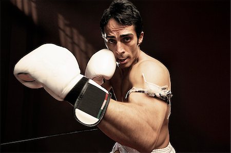 simsearch:614-00657246,k - Boxer standing with gloved fists Stock Photo - Premium Royalty-Free, Code: 614-08868974