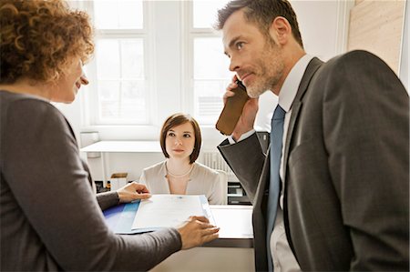 simsearch:649-06041170,k - Business people talking in office Stock Photo - Premium Royalty-Free, Code: 614-08869069