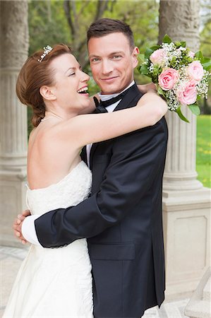 simsearch:649-06432557,k - Newlywed couple hugging outdoors Stock Photo - Premium Royalty-Free, Code: 614-08869412