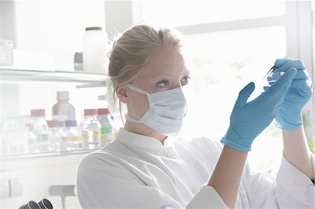 simsearch:649-07118434,k - Scientist examining test tube in lab Stock Photo - Premium Royalty-Free, Code: 614-08869503