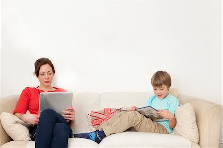 simsearch:614-06442812,k - Mother and son relaxing on couch Stock Photo - Premium Royalty-Free, Code: 614-08869513