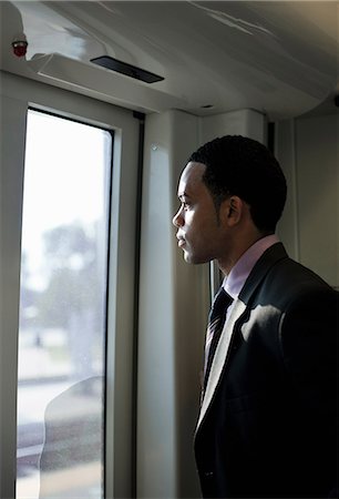 simsearch:614-06897927,k - Businessman on a train, looking through window Foto de stock - Sin royalties Premium, Código: 614-08874208