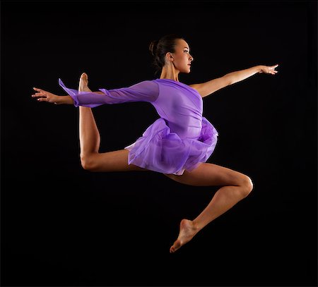 Graceful ballerina in mid air Foto de stock - Sin royalties Premium, Código: 614-08874270