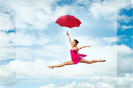 simsearch:400-06481645,k - Ballerina with umbrella, leaping against cloudy sky Stock Photo - Premium Royalty-Free, Code: 614-08874271