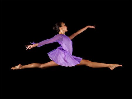 simsearch:400-06481645,k - Ballerina doing the splits in mid air Stock Photo - Premium Royalty-Free, Code: 614-08874272