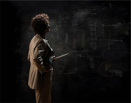 simsearch:614-06043814,k - Woman looking at blackboard with digital tablet Stock Photo - Premium Royalty-Free, Code: 614-08874374