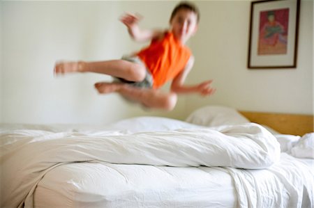 picture (artwork) - Boy jumping on bed Stock Photo - Premium Royalty-Free, Code: 614-08874823