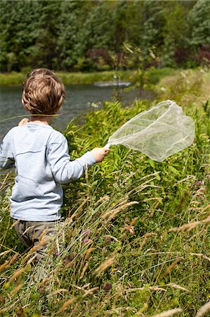 simsearch:614-05557077,k - Young boy in meadow with butterfly net Stock Photo - Premium Royalty-Free, Code: 614-08874838